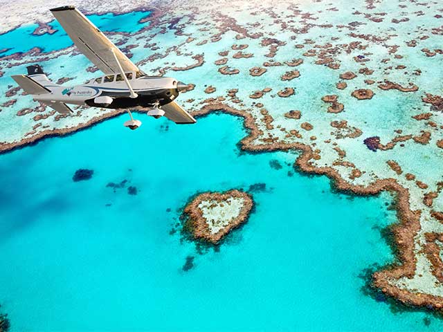 Secen fligh over great barrier reef and whitehaven beach