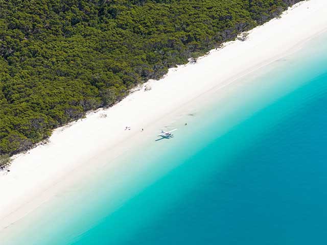 Seaplane sitting at whitehaven beach