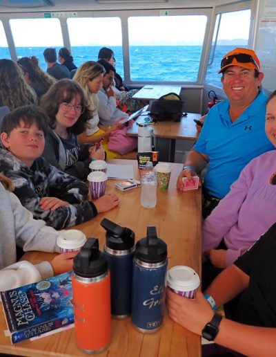 Family sitting at the tables on super flyer zigzag whitsundays