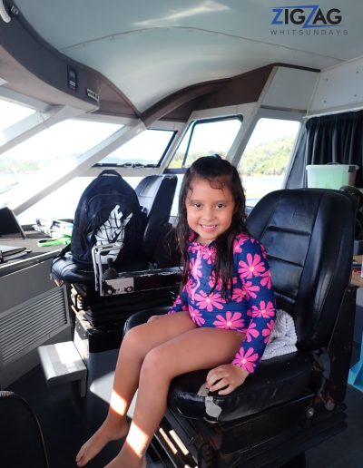 Child sitting in the captains chair