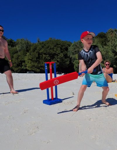 Playing beach cricket at whitehaven beach