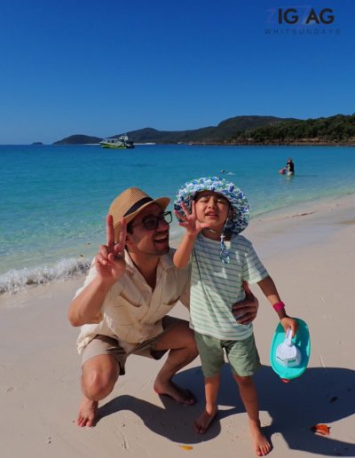 Father and child at whitehaven beach