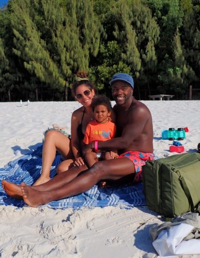 Family relaxing at whitehaven beach