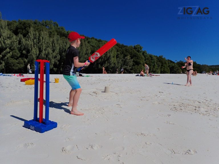 Playing beach cricket at whitehaven beach