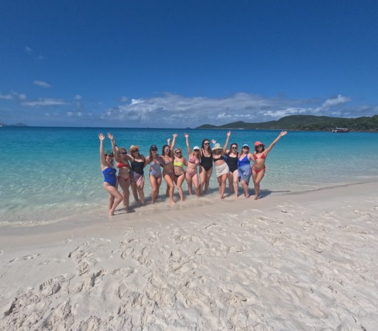 Group of girls enjoying their beach time on whitsunday island